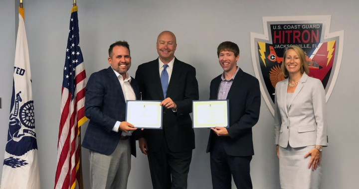 Frank McInturff and Robert Bailey accepting EPA team award